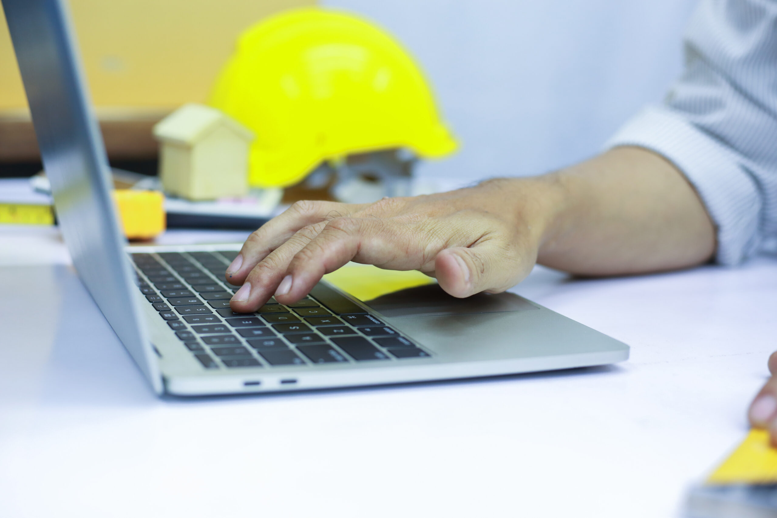 Image of a construction worker using a grinder with sparks flying