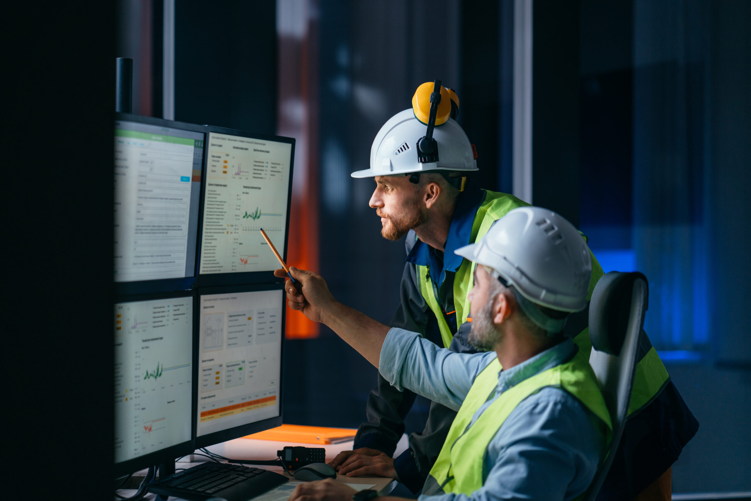 Image of construction workers looking at a construction budget