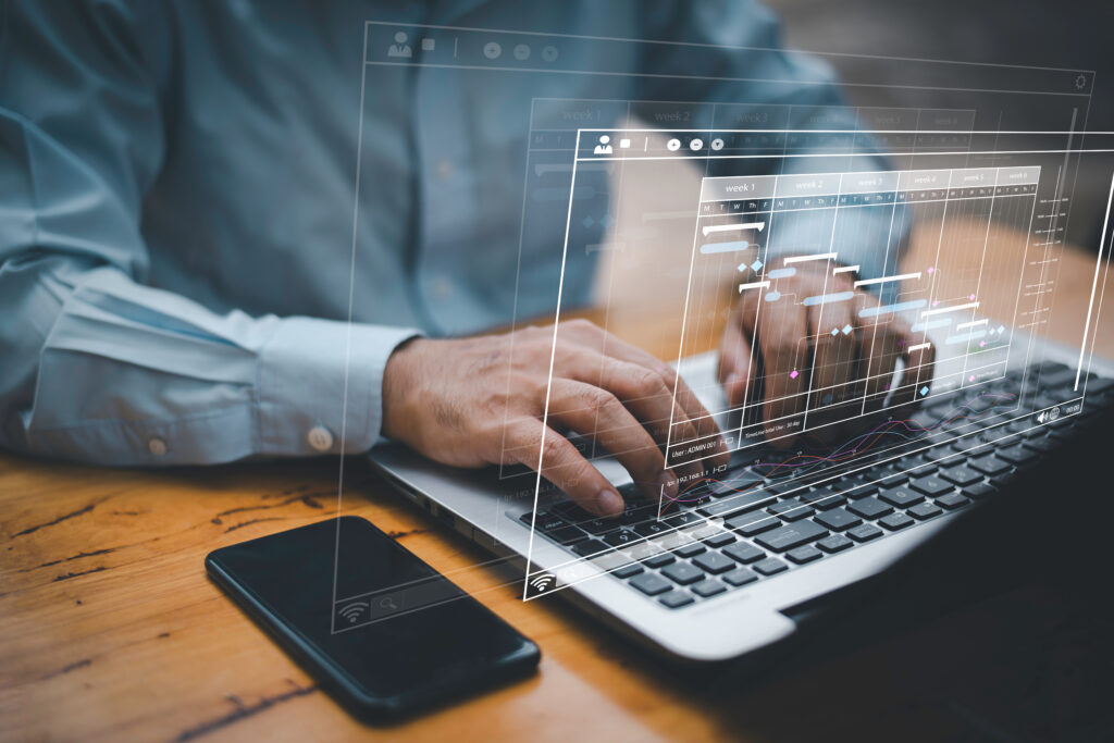 Image of a futuristic overlay on a laptop for budget control software