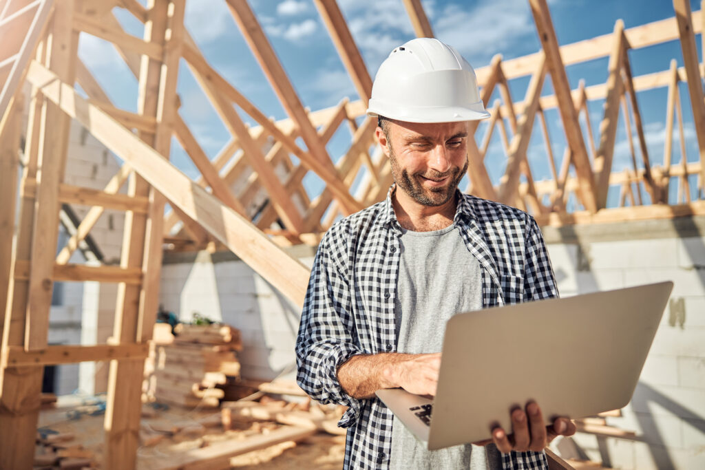 Image of a man checking his construction project app