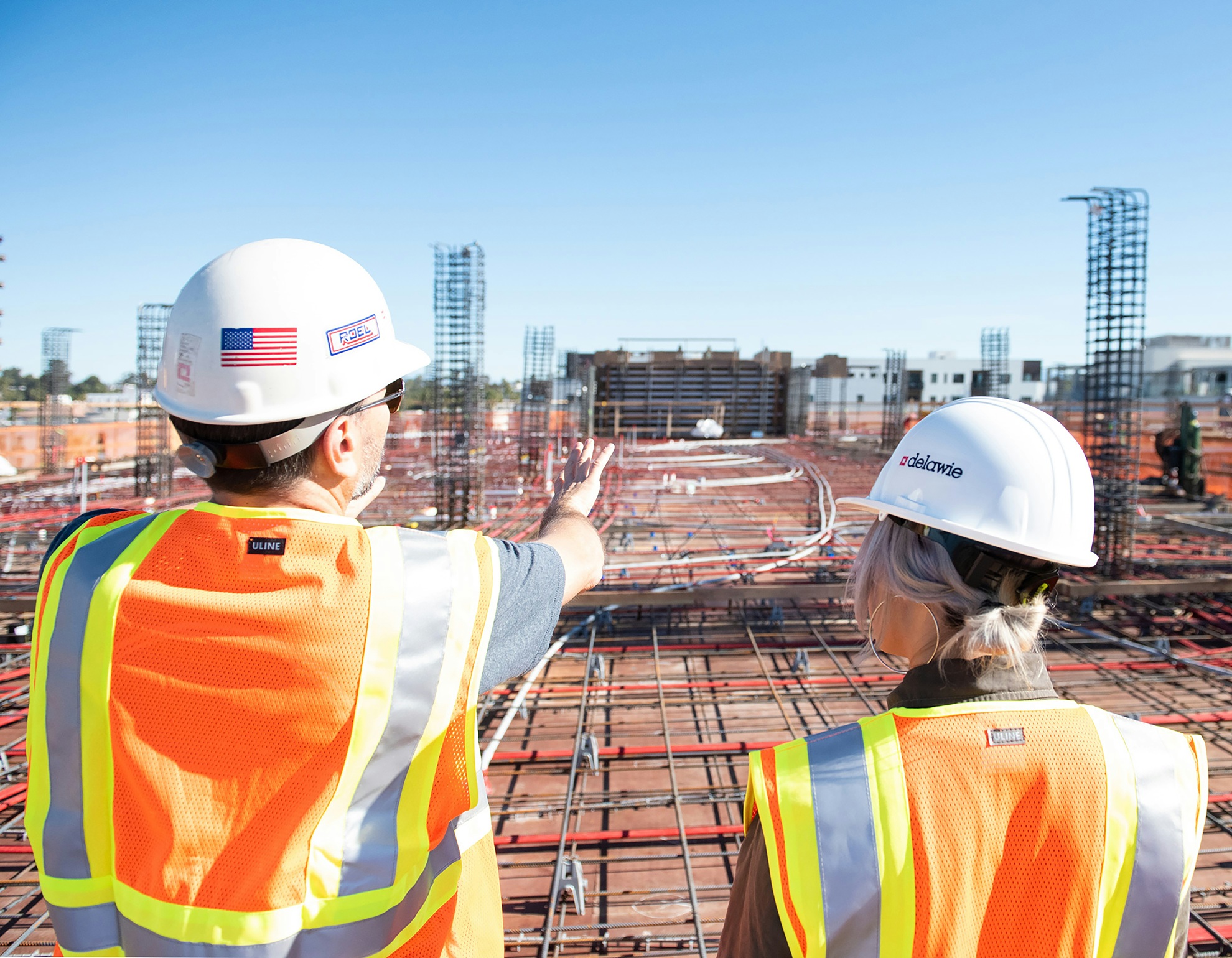 Image of construction workers looking at a construction project