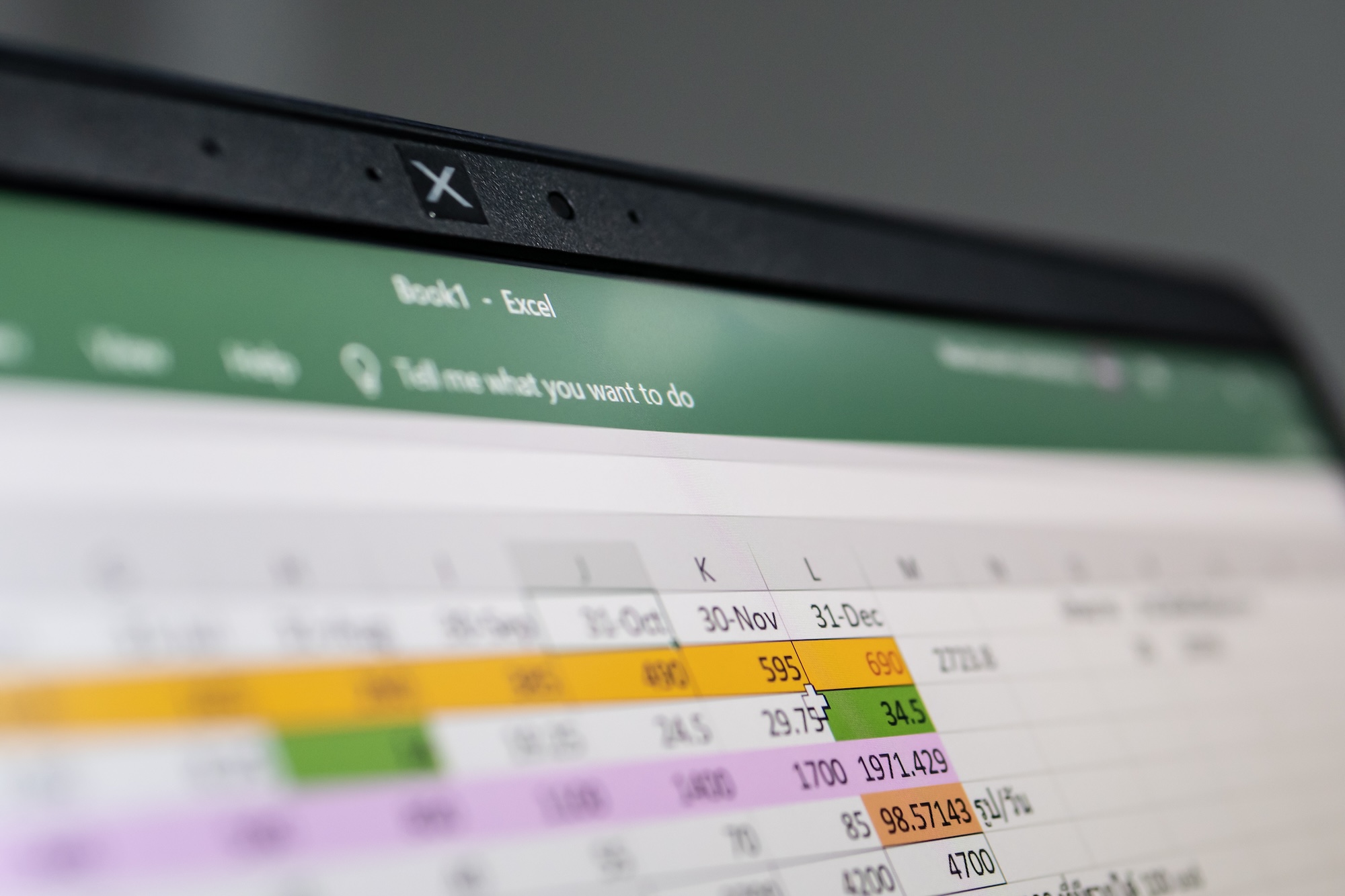 Image of a laptop displaying an Excel spreadsheet